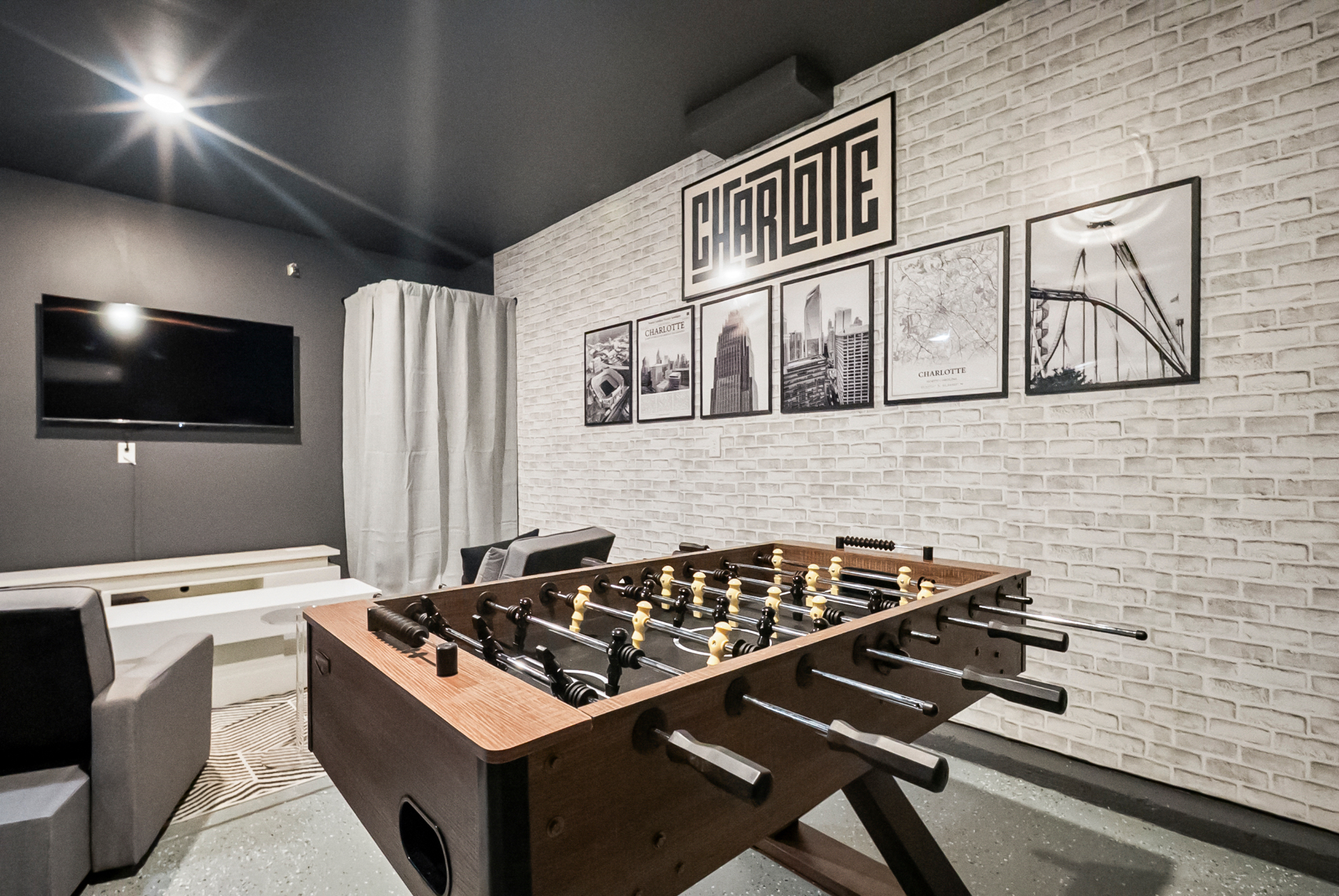 Designer game room in a Stayvanah Charlotte short-term rental